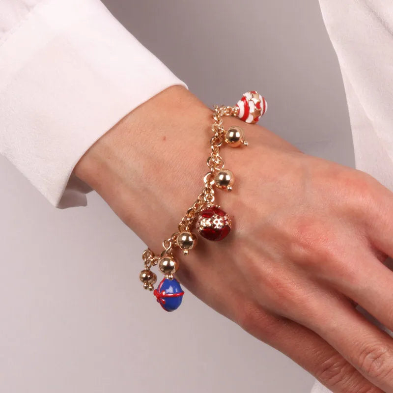 Metal bracelet with ball-shaped pendants