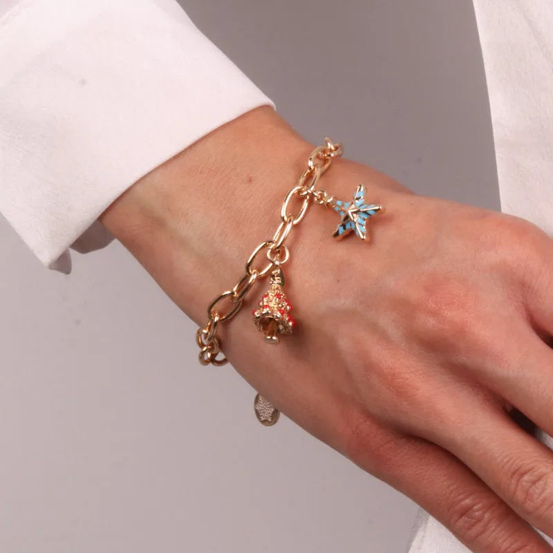 Metal bracelet with Christmas tree and star shaped pendants