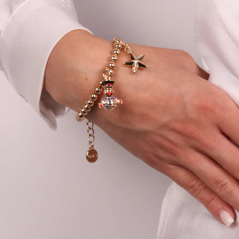Metal bracelet with snowman and star shaped pendants
