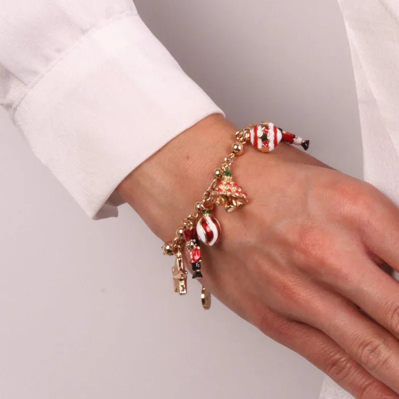 Metal bracelet with pendants in the shape of a Christmas tree, nutcracker, balls and stars