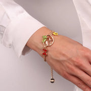 Bracciale in Metallo con pigna, fiocco e ferro di cavallo in smalto colorato
