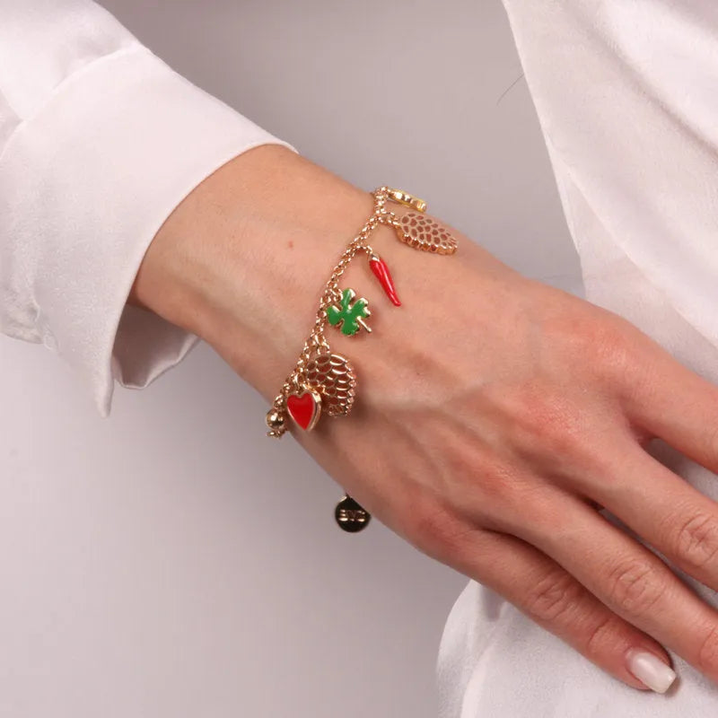Metal bracelet with pine cone and lucky symbols