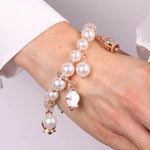 Bracciale in Metallo Bracciale in Metallo con perle e campanelle portafortuna in smalto bianco con scritta Capri