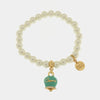 Bracciale in Metallo Bracciale in Metallo con perle e campanella portafortuna in smalto verde con scritta Capri