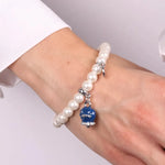 Bracciale in Metallo Bracciale in Metallo con perle e campanella portafortuna in smalto blu con scritta Capri