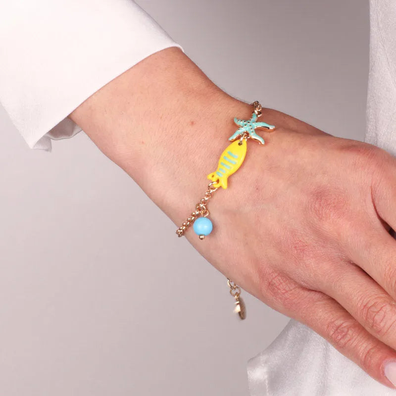 Metal bracelet with marine symbols