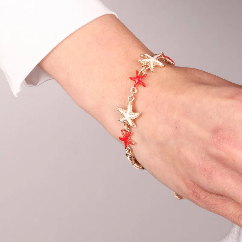 Metal bracelet with white and red starfish