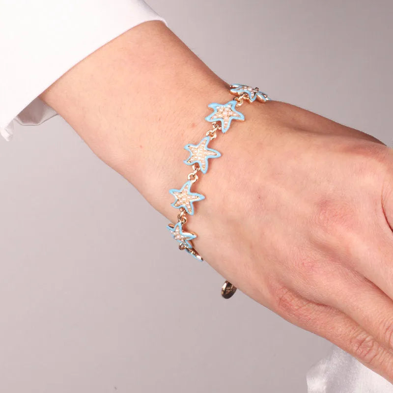 Metal bracelet with blue starfish
