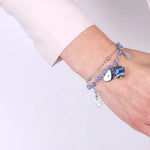 Bracciale in Metallo con campana smaltata blu e cuoricini pendenti