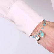 Bracciale in Metallo con campana smaltata azzurra e cuoricini pendenti