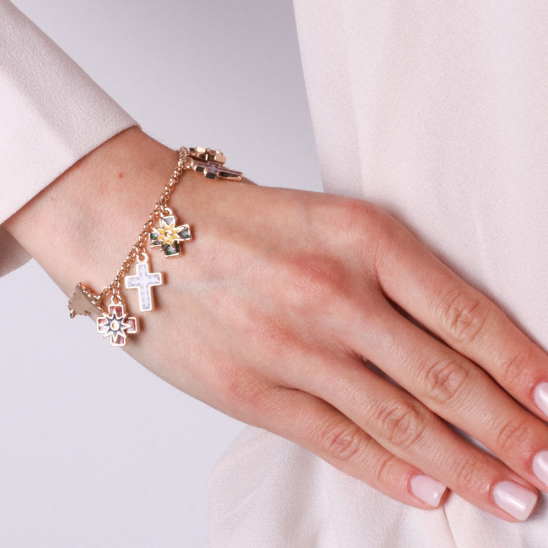 Metal bracelet with hanging crosses