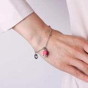 Bracciale in Metallo con campanella portafortuna pendente, impreziosita da smalto e punto luce