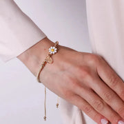 Bracciale in Metallo con cordino bianco e sfere con margherita