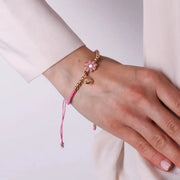 Bracciale in Metallo con cordino rosa e sfere con margherita