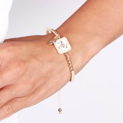 Bracciale in Metallo con trinacria e cordino bianco