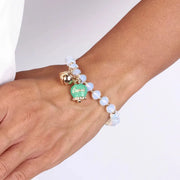 Bracciale in Metallo  campanella verde e piccolo sonaglio con pietre bianche