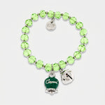 Bracciale in Metallo  campanella verde e piccolo sonaglio con pietre verdi