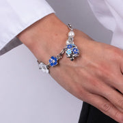 Bracciale in Metallo con campanella e fiori blu e bianchi