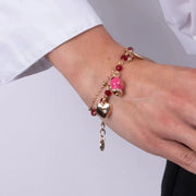 Bracciale in Metallo multifilo con campanella fucsia e pietre rosse