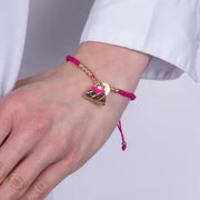 Bracciale in Metallo con cordino rosso e borsa rosa