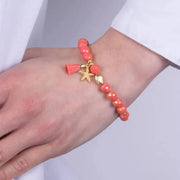 Bracciale in Metallo con sfere rosse  e ciondolo stella marina