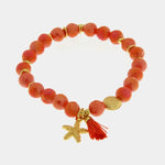 Bracciale in Metallo con sfere rosse  e ciondolo stella marina
