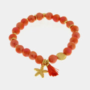 Bracciale in Metallo con sfere rosse  e ciondolo stella marina