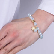 Bracciale in Metallo con sfere bianche e ciondoli a conchiglia