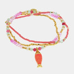 Bracciale in Metallo con perline rosse e ciondolo pesciolino