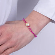 Bracciale in Metallo perla sintetica centrale e cristalli rosa