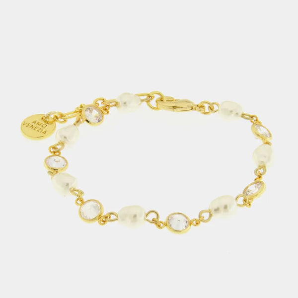Metal bracelet with synthetic pearls and white crystals