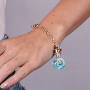 Bracciale in Metallo con bottiglina con fiore e pesciolino