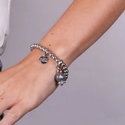 Bracciale in Metallo con campanella grigia scritta capri