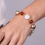 Bracciale in Metallo con crisatlli e perle marroni