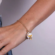 Bracciale in Metallo con capuzzella bianca impreziosita da fiori colorati