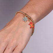 Bracciale in Metallo con fiocchi di neve e omino di pan di zenzero