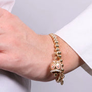 Bracciale in Metallo con campanella a pois rosa e zirconi