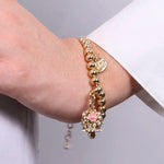 Bracciale in Metallo con campanella con fiori e perle - BYSIMON gioielli