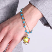 Bracciale in Metallo multifilo azzurro con campana a fiori multicolor