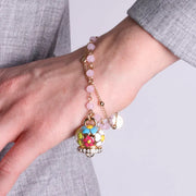 Bracciale in Metallo multifilo rosa con campana a fiori multicolor