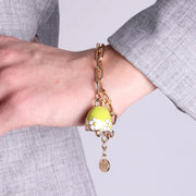 Bracciale in Metallo con campanella verde e  fiori