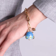 Bracciale in Metallo con campanella blu e  fiori