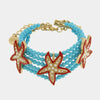 Bracciale in Metallo con sfere turchesi e stelle marine rosse