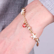 Bracciale in Metallo con stelle marine bianche e conchiglie rosse