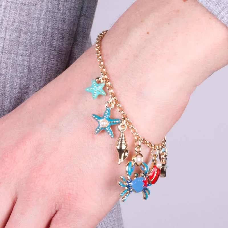 Bracciale in Metallo con granchio, stelle marine, pesciolino e conchiglie bys - gioiello BySimon