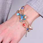 Bracciale in Metallo con granchio, stelle marine, pesciolino e conchiglie - BYSIMON gioielli