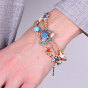 Bracciale in Metallo con granchio, stelle marine, pesciolino e conchiglie