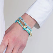 Bracciale in Metallo multifilo con cristalli verdi e conchiglia