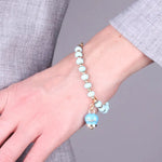 Bracciale in Metallo con sfere e campanella Capri turchese