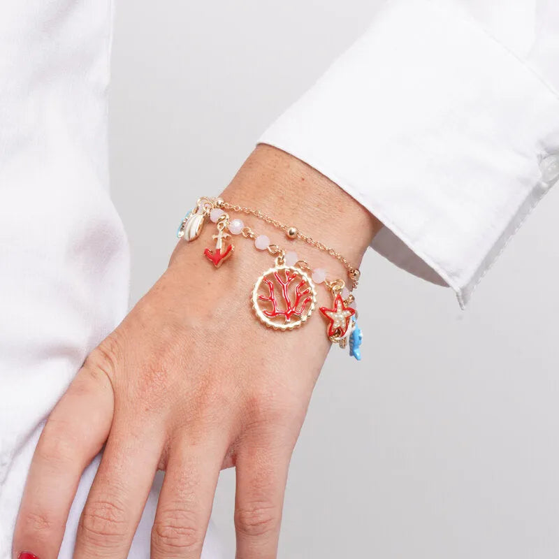 Bracciale in Metallo multifilo con stelle marine, conchiglia, pesciolino, ancora e corallo - BYSIMON gioielli